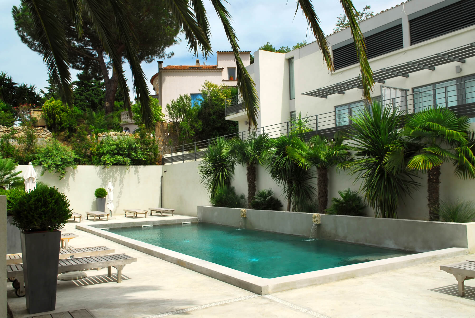 Mediterranean style pool with stone coping