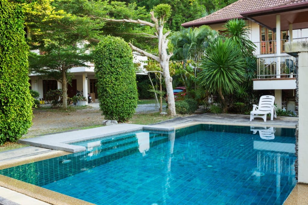 Tiled pool with a raised shallow ledge and wide steps built into one end