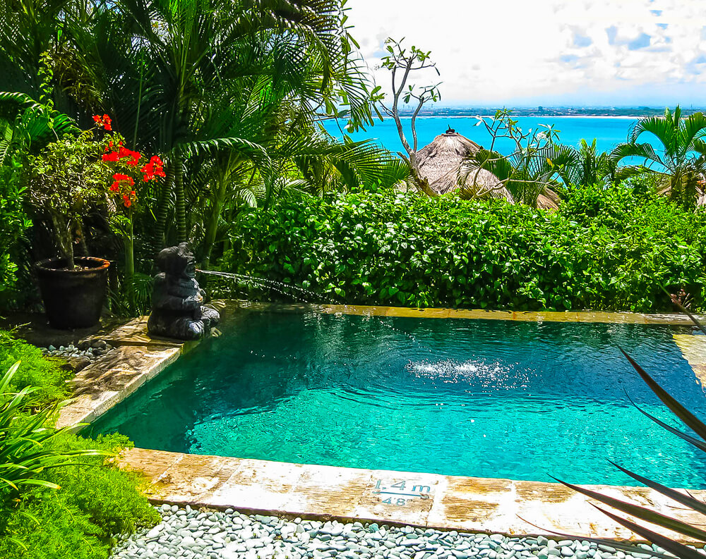 Small pool with refreshed landscaping by Big Easy Pool Designs